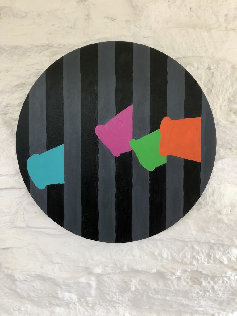 Stylised multicoloured pig snouts protrude bars of their cage. Acrylic paint on a circular shaped mount. "Pop art" in style.